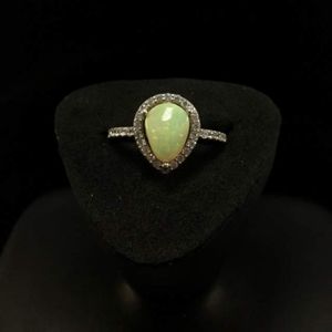 White pinfire opal sterling silver teardrop ring.